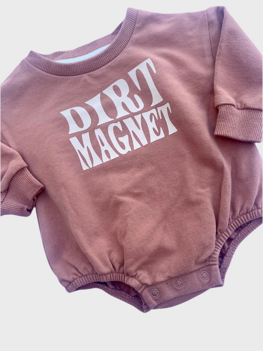 Dusty rose oversized onesie sweater. Dirt magnet and tractor graphic. 