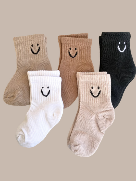 set of five toddler socks with smiley faces